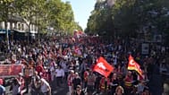 FILE: Protesters march during a demonstration called by major trade unions to oppose budget cuts, in Paris, France, Thursday, Sept. 18, 2025. 