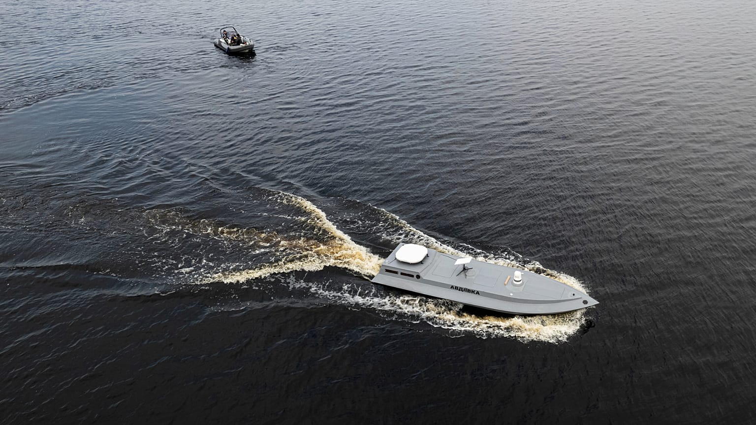 FILE - A sea drone cruises on the water during a presentation by Ukraine's Security Service in Kyiv region, Ukraine, on Tuesday, March 5, 2024