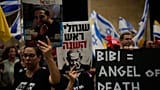 People take part in a protest demanding the end of the war and immediate release of hostages held by Hamas