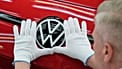An employee of the German car manufacturer Volkswagen checks an ID.3 electric car at the transparent factory in Dresden, Germany. 14 May 2025.