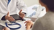 A doctor talks to his patient.