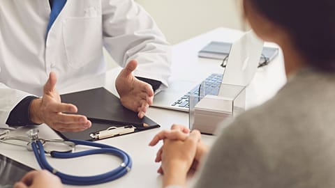 A doctor talks to his patient.