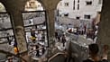 Palestinians survey the aftermath of an Israeli military strike on the Abu Dahrouj family home in Zawaida