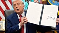 President Donald Trump holds a signed executive order regarding TikTok in the Oval Office at the White House, Thursday, Sept. 25, 2025, in Washington. 