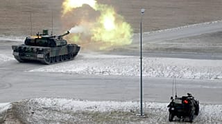 A Leclerc tank fires a shell during a military exercise at a military camp near Reims, in 2018