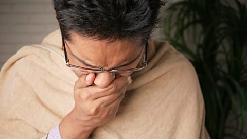A man yawns.