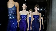 Models wear creations as part of the Giorgio Armani Spring/Summer 2026 collection show in Milan, Italy, Sunday, Sept. 28, 2025