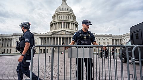 Capitol Police officers adjust security barriers around the East Plaza at the Capitol in Washington, Wednesday, Sept. 24, 2025. (AP Photo/J. Scott Applewhite)