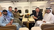 US citizen Amir Amiri, left, poses next to an unidentified woman, aboard a plane in Kabul, Afghanistan, on Sunday, Sept. 28, 2025, after being released from an Afghan prison.