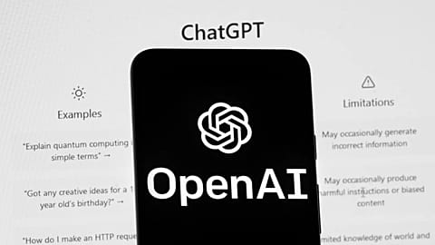 FILE - The OpenAI logo is seen on a mobile phone in front of a computer screen which displays the ChatGPT home Screen, on March 17, 2023, in Boston.