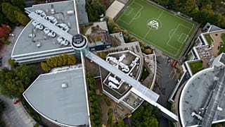 The EA Sports logo is seen on a soccer pitch at the Electronic Arts' office and studio complex, in Burnaby, British Columbia. 29 Sept. 2025.