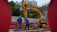 Workers at a construction site at the Shenzhen Bay commercial district, in Shenzhen, China's Guangdong province. 19 Sept. 2025.