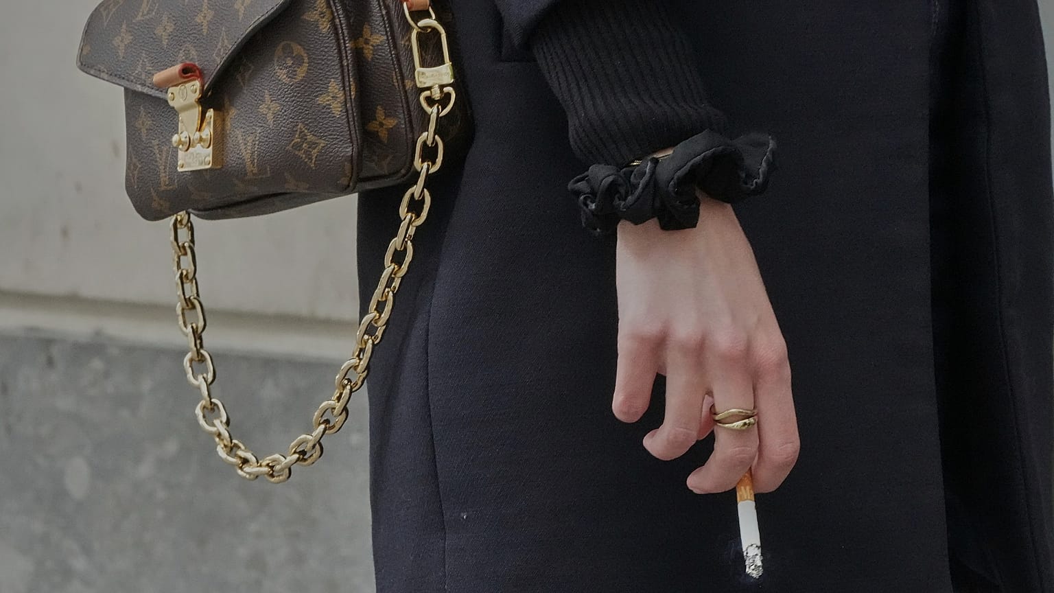 FILE: A woman holds a cigarette during a break in Paris, 28 May 2025