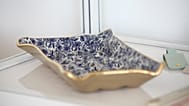 A blue and gold ceramic egg tray from the Etsy seller Claylicious. 29 Sept. 2022.