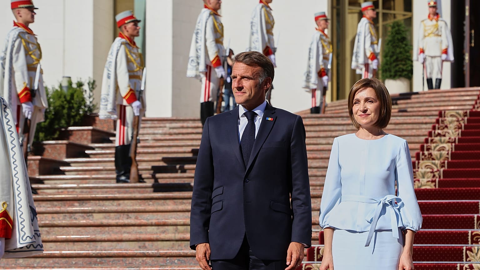 French President Emmanuel Macron poses with Moldova's President Maia Sandu, outside the country's presidency headquarters in Chisinau, Moldova, 27 August 2025.