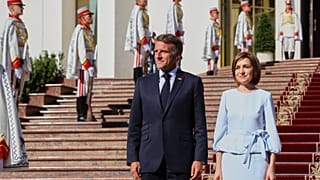 French President Emmanuel Macron poses with Moldova's President Maia Sandu, outside the country's presidency headquarters in Chisinau, Moldova, 27 August 2025.