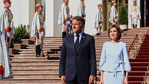French President Emmanuel Macron poses with Moldova's President Maia Sandu, outside the country's presidency headquarters in Chisinau, Moldova, 27 August 2025.