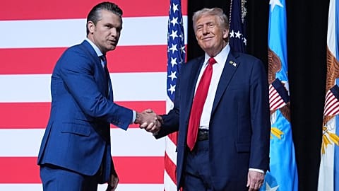 US President Donald Trump is greeted by Secretary of Defense Pete Hegseth on Tuesday, Sept. 30, 2025, in Quantico, Va, United States