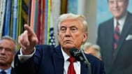FILE. President Donald Trump points to a reporter in the Oval Office of the White House. 30 Sept. 2025.
