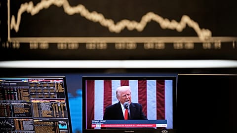 US President Donald Trump appears on a television screen at the stock market in Frankfurt, Germany, Thursday, 3 April 2025.