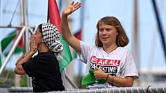 FILE: Activist Greta Thunberg waves from a boat, in Barcelona, 31 August 2025