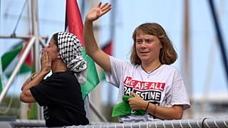 FILE: Activist Greta Thunberg waves from a boat, in Barcelona, 31 August 2025