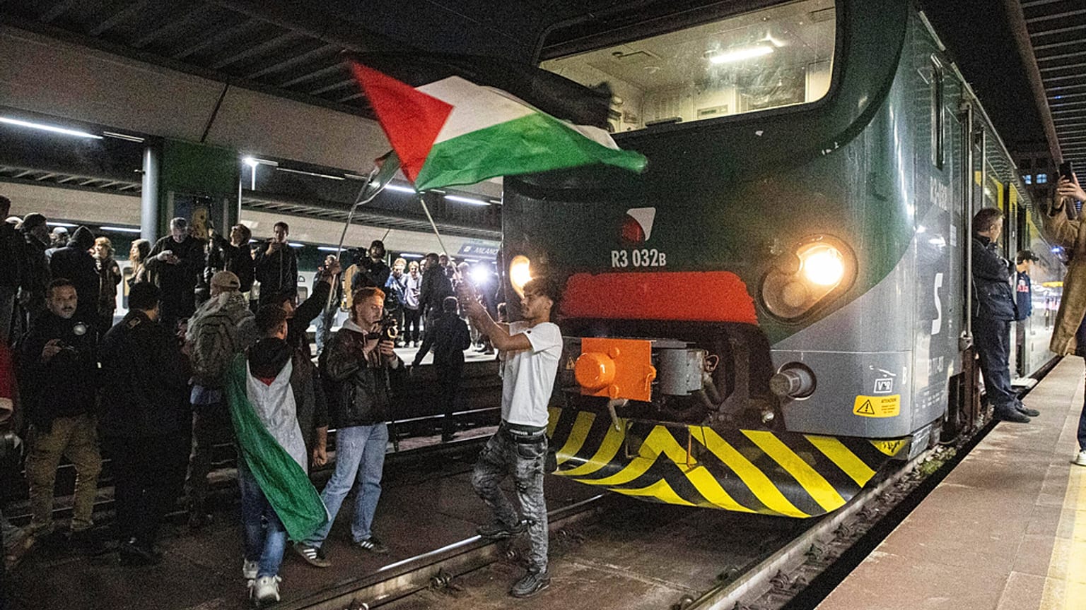 Pro-Palestinian protesters demonstrate at Cadorna train station in solidarity with the Global Sumud Flotilla on Wednesday, Oct. 1, 2025, in Milan, Italy.