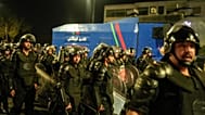 Security forces disperse a gathering