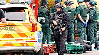 An armed police officer at the scene of a stabbing incident at Heaton Park Hebrew Congregation synagogue, in Manchester, 2 October 2025