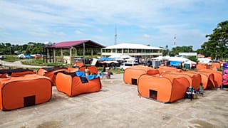Survivors of Tuesday's earthquake stay at an evacuation center