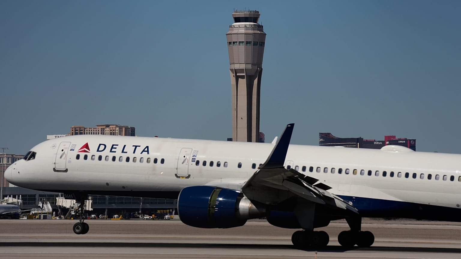 A plane lands at Harry Reid International Airport, Tuesday, Oct. 7, 2025, in Las Vegas.