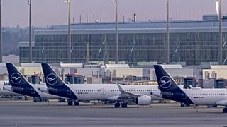 Lufthansa aircraft sit at Terminal 2 at Munich Airport, Germany Monday morning, March 10, 2025.