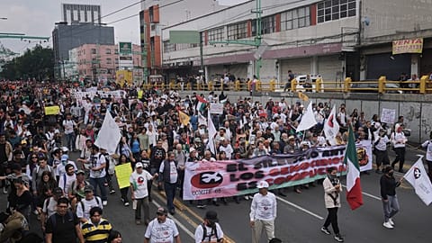 Demonstrators march during a protest commemorating the anniversary of the 1968 Tlatelolco killings