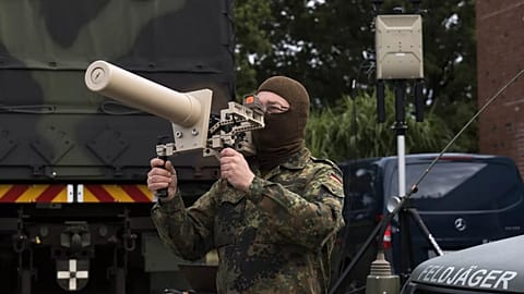 A Germany soldier presents the Counter UAV Jammer HP 47 on the second day of Bundeswehr exercises in Hamburg, 26 September, 2025