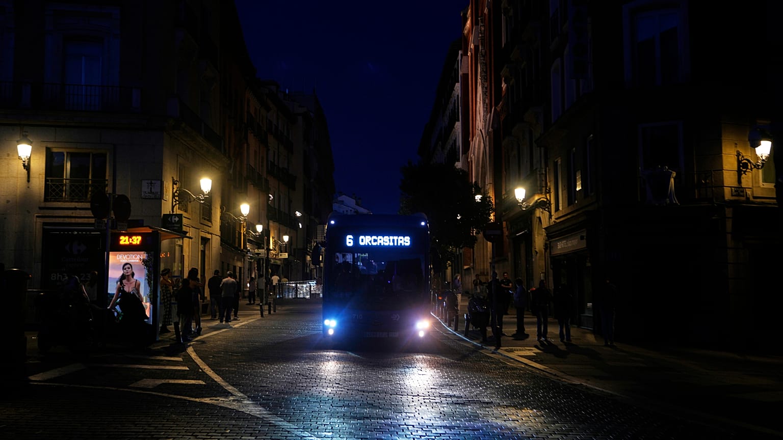 FILE: A bus drives in downtown Madrid during a major power outage, 28 April 2025