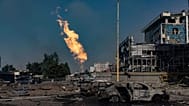 Gas burns in front of a business centre damaged by a Russian attack in Kharkiv, 1 September, 2024