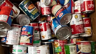 Canned goods are collected at Neighbor's Cupboard in Winterport, 26 August, 2025