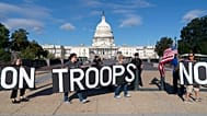 Demonstrators protest against President Donald Trump's use of federal law enforcement and National Guard troops in the city during a protest at the U.S. Capitol, Tuesday, Sept