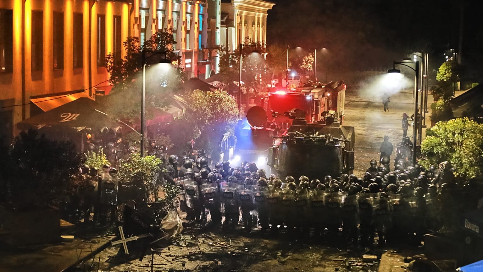 Police block a street to prevent demonstrators from advancing during an opposition rally in the city center of Tbilisi, Georgia, on Saturday, Oct. 4, 2025