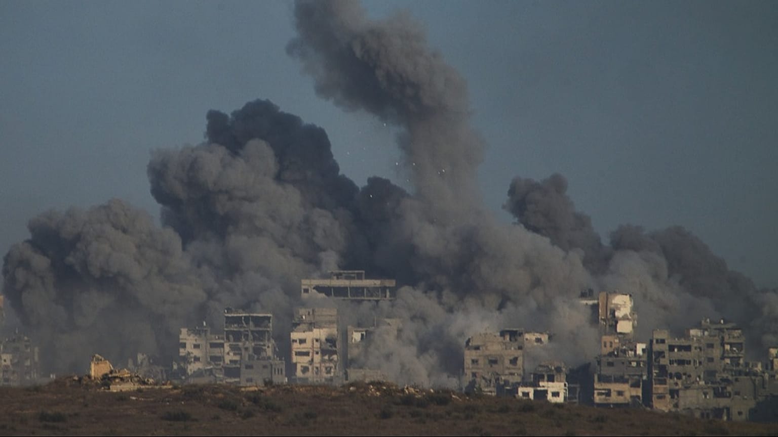 Smoke billows over Gaza Strip following an Israeli bombardment, as seen from southern Israel, Sunday, Oct. 5, 2025