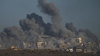 Smoke billows over Gaza Strip following an Israeli bombardment, as seen from southern Israel, Sunday, Oct. 5, 2025