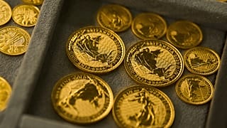 FILE - A collection of gold coins is displayed at a shop in the St. Vincent Jewelry Center in the Jewelry District of Los Angeles, 30 April 2025