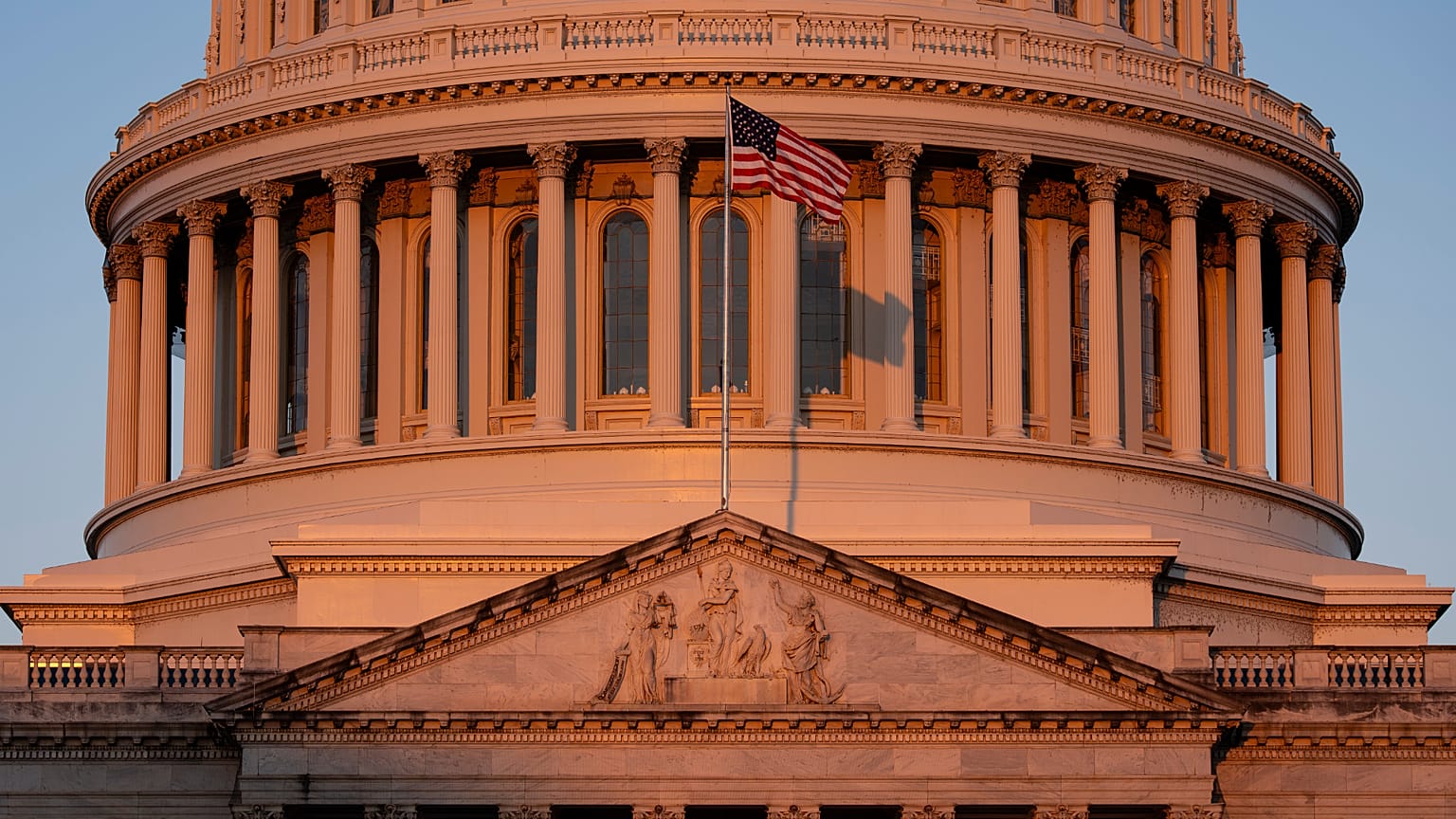 The Capitol is illuminated at dawn in Washington, Monday, Oct. 6, 2025. (AP Photo/J. Scott Applewhite)