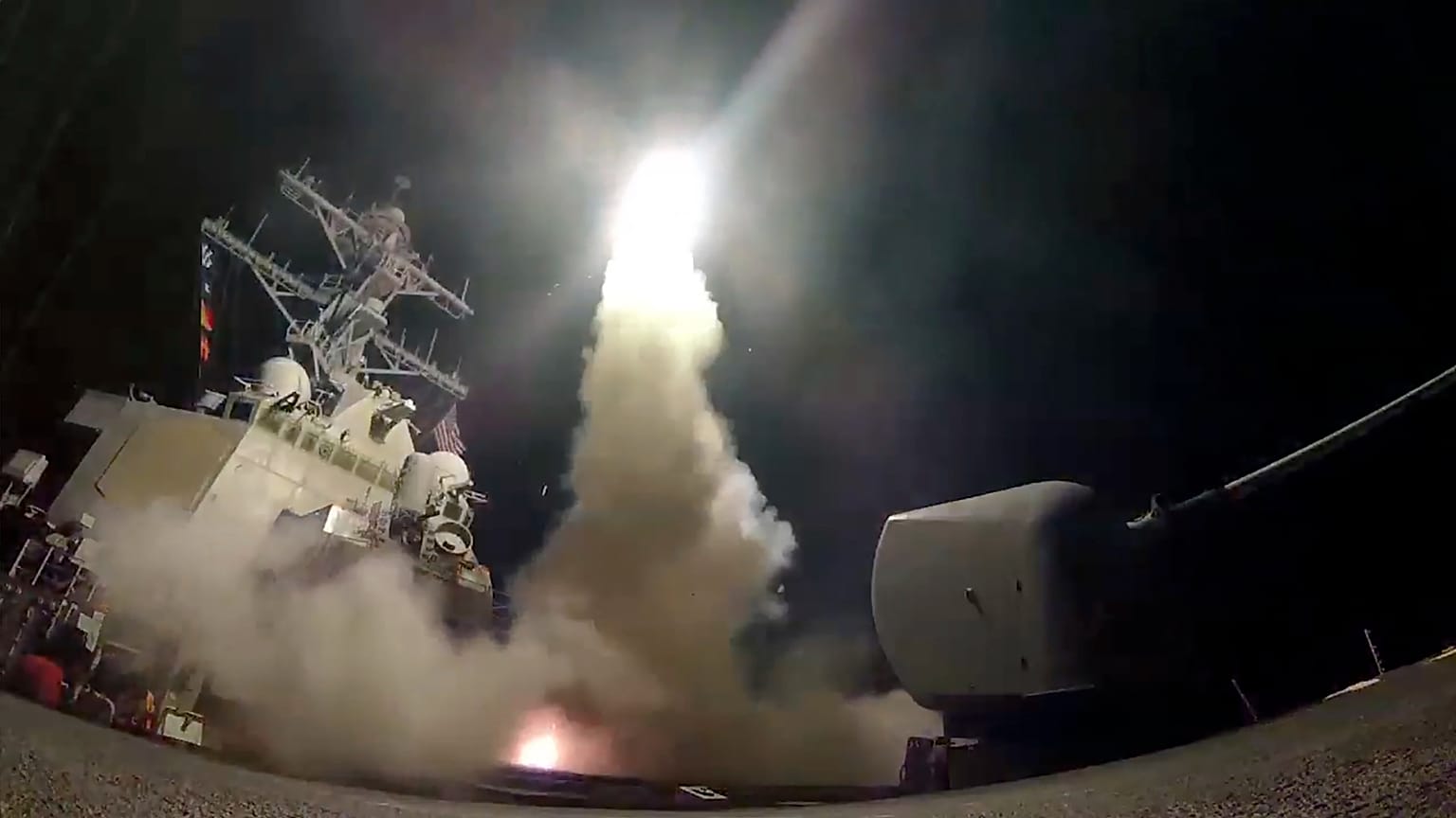 FILE - In this file image from video provided by the U.S. Navy, the guided-missile destroyer USS Porter launches a tomahawk missile in the Mediterranean Sea, Apr 7, 2017.