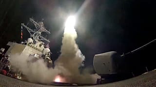 FILE - In this file image from video provided by the U.S. Navy, the guided-missile destroyer USS Porter launches a tomahawk missile in the Mediterranean Sea, Apr 7, 2017.
