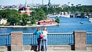 Tourists looking at a view of Stockholm on 2 July, 2015.
