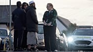 Locals view the damage outside the front entrance of the mosque in Peacehaven following a suspected arson attack, 5 October, 2025