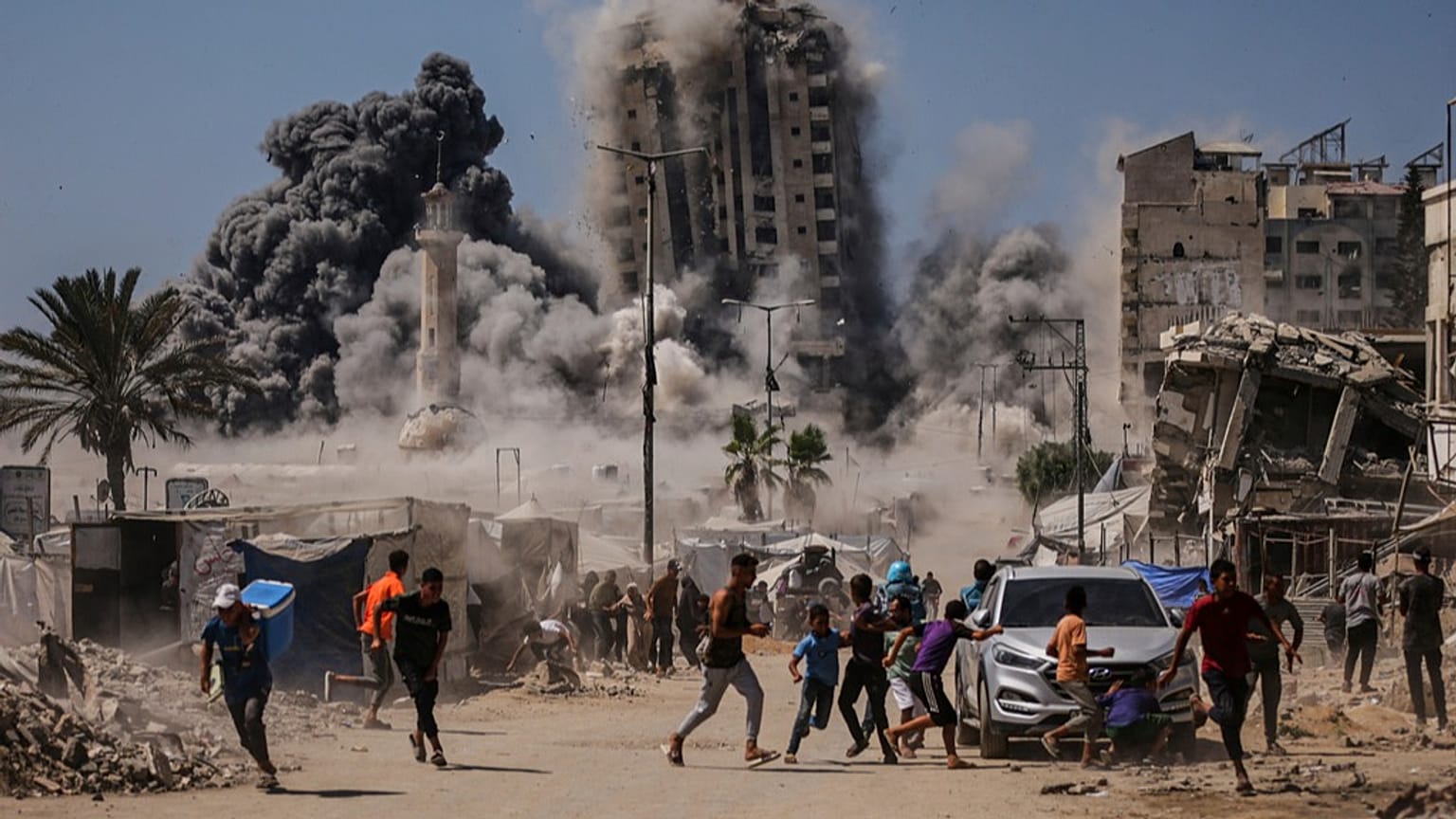 People run for cover during an Israeli airstrike on a high-rise building in Gaza City, Friday, Sept. 5, 2025, after the Israeli army issued a warning