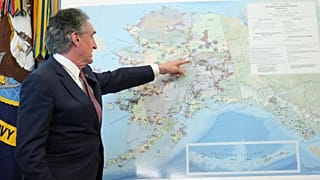 Interior Secretary Doug Burgum points to a map of Alaska as he speaks before President Donald Trump signs an executive order in the White House.