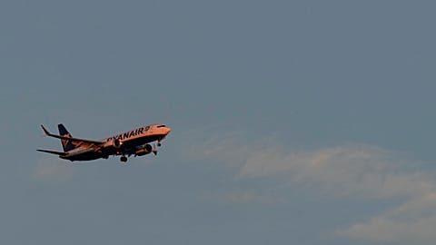 A Ryanair Boeing 737 MAX 8 approaches for landing in Lisbon at sunrise